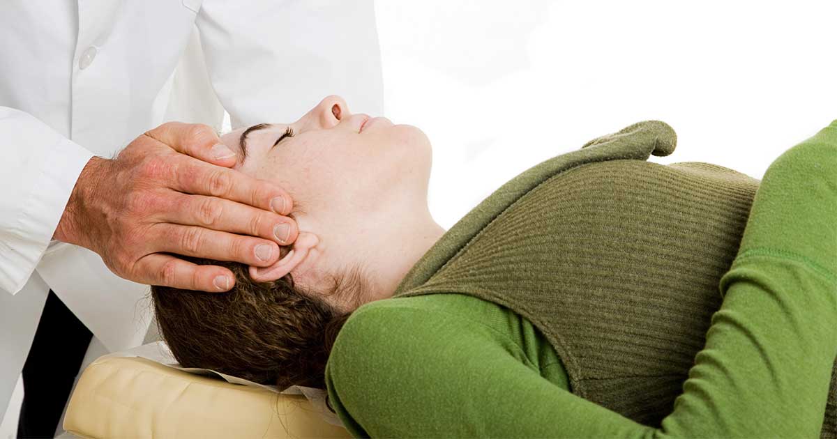 Chiropractor adjusting patient's neck - Common Myths About Chiropractic Care